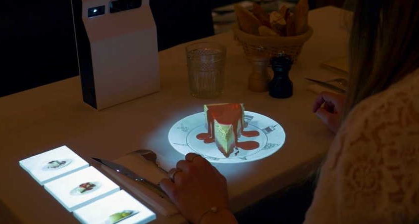 Is it modern to use holograms for customers in restaurants?